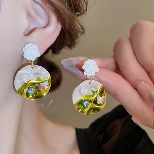 Vintage floral and butterfly stud earrings with cream resin and crystal accents