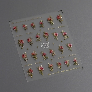 Detail view of 3D embossed pink rose nail stickers with gold edges and starry accents