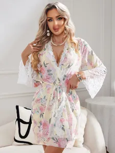 Detailed lace trim on light yellow floral loungewear robe with elegant butterfly patterns