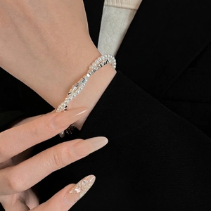 Double-layered pearl and silver bead bracelet for women featuring minimalist luxury design