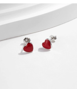 Close-up of S925 sterling silver stamp on red enamel heart stud earrings