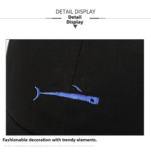 Detail of high-quality black twill cotton baseball cap with blue fish embroidery