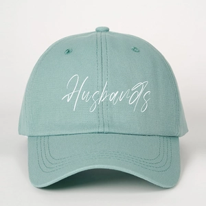 Mint green cotton baseball cap with white Husbands embroidery and curved brim