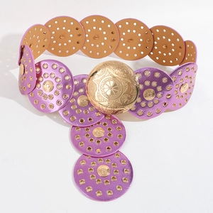 Detailed view of pink and brown fashion belt with golden buckle and metallic discs