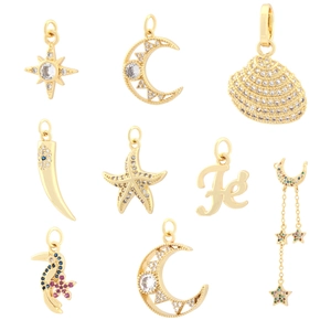 Selection of 9 gold-plated pendants featuring moon, star, and shell designs with zircon