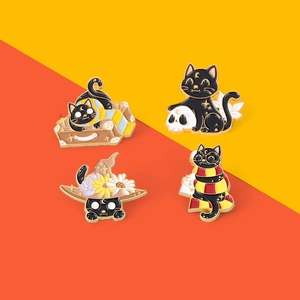 Set of 4 black cat enamel pins featuring magic wizard themes on bright yellow backdrop