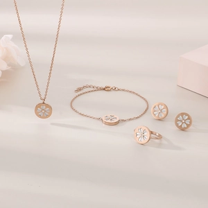 Elegant rose gold jewelry set with white cherry blossom motifs and sparkling crystals