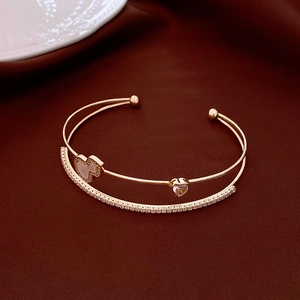 Double-layered rose gold open bangle featuring heart-shaped zircon and pave crystals