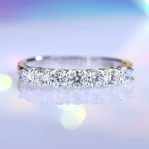 Macro shot of S925 sterling silver row ring featuring seven sparkling round cut zircons