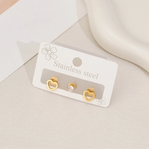 Three-piece stainless steel earring set with gold heart studs and cubic zirconia accents