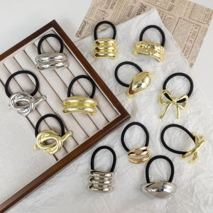 Minimalist alloy hair ties with gold and silver geometric accents on elastic bands
