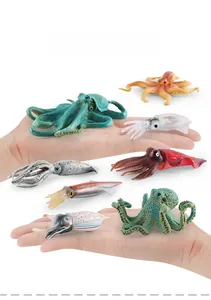 Detailed comparison of realistic sea creature toy models showing actual size by hand
