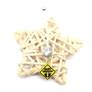 Flexible belly button ring with Baby on Board pendant and yellow zircon on star decor