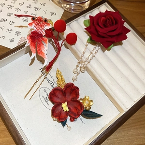 Detail of red floral hair clip with pearl tassels and koi embroidery Chinese style set