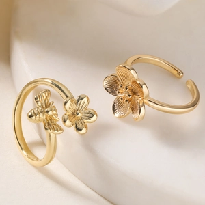 Adjustable 18K gold plated rings set featuring delicate bee and flower designs