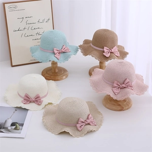 Kids woven straw sun hats with wave rims, pearl bows, in blue, pink and white