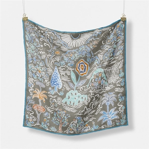 Detail of grey vintage floral silk scarf hanging on white wall with professional lighting