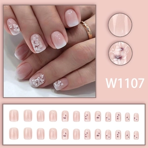 Short square pink and white gradient press-on nails with delicate white flower patterns