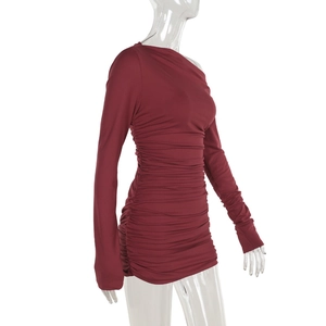 Detail of burgundy ruched stretch fabric and side drawstring on slim fit dress