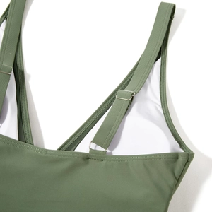 Detail of adjustable shoulder strap with silver buckle on army green swimsuit
