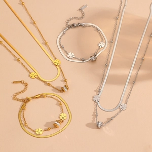 Double-layered stainless steel four-leaf clover necklaces and bracelets in gold and silver