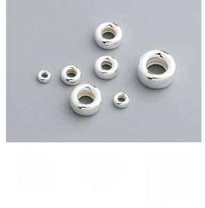 Detailed view of various sizes of S925 sterling silver bubble beads for DIY jewelry making