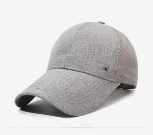 Detail of dark gray mesh baseball cap with metal SORT emblem and breathable fabric