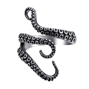 Macro shot of vintage silver octopus tentacle ring with detailed suckers and retro texture