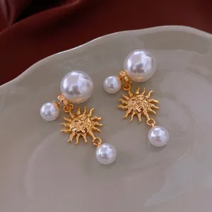 French vintage sun god earrings with elegant white pearls in luxury gold finish