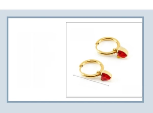 Detailed view of heart-shaped red zircon earrings with 18K gold plated stainless steel