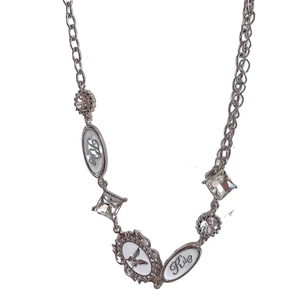 Y2K punk silver necklace with butterfly pendant and white crystal charms on white background
