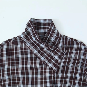 Women's brown plaid long sleeve shirt featuring an asymmetric buttoned high collar detail