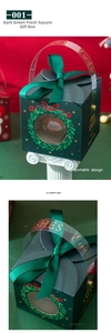Detail of square dark green Christmas gift box with festive wreath and ribbon handle