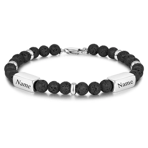 Macro detail of 8mm black lava stone beads and customizable laser engraved steel plaques