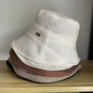 Breathable lace knit bucket hat set for women featuring mesh texture and metal detail