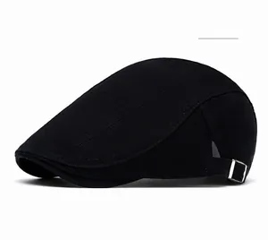 Detail of black cotton ivy cap showing twill texture and silver metal side buckle