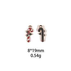 Macro view of Christmas candy cane alloy pendant with 19x8mm size details and back texture