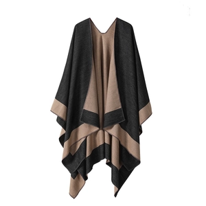 Detailed knit poncho shawl featuring dark grey and camel contrast with elegant V-neck drape