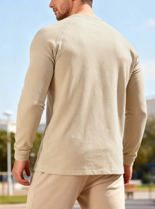 Men's waffle knit long sleeve henley shirt showing back view and raglan sleeve design