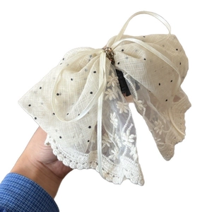 Elegant off-white bow hair claw clip with black polka dots and floral lace embroidery