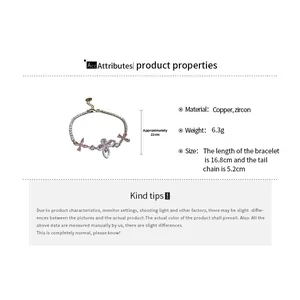 Detail showing pink zircon butterfly charms on a copper bracelet with size measurements