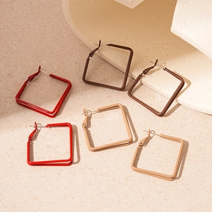 Minimalist double-layered square stud earrings in red, brown, and tan geometric design