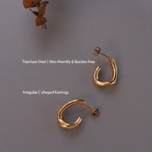 Polished titanium steel irregular C-shaped gold earrings for women with a minimalist design