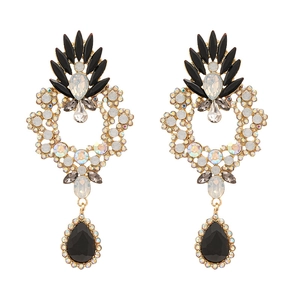 Vintage palace style gold drop earrings with black resin stones and shimmering crystals