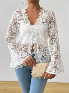 Elegant white lace long sleeve cardigan with flared cuffs and intricate hollow patterns