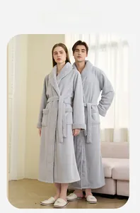 Close-up of thick grey winter bathrobe with plush shawl collar and matching belt details