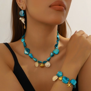 Bohemian gold jewelry set with blue stones, white shells and starfish charms for women