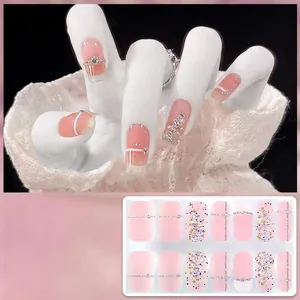 Pink and white Christmas gel nail wraps with glitter and silver sparkle detail, model CS-416