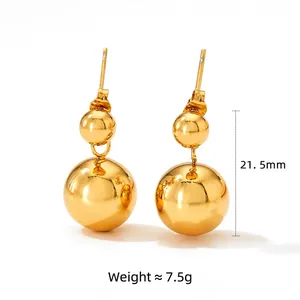 Polished gold stainless steel double ball drop earrings with minimalist high-shine finish