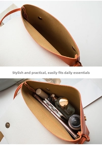 Detail view of leather and canvas crossbody bag showcasing internal space for daily items